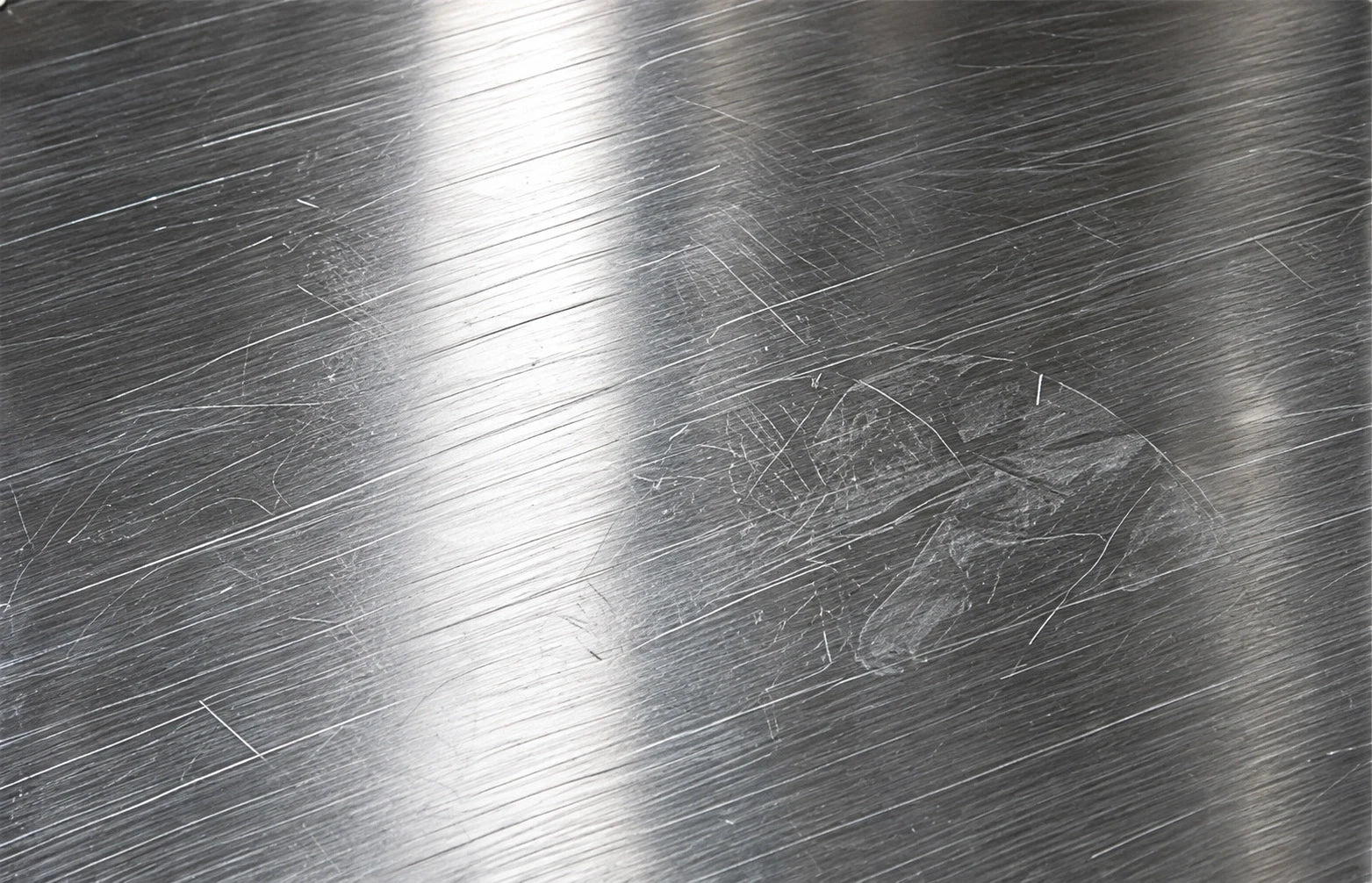 Streaks across a stainless steel surface